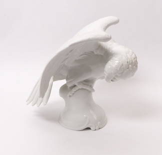 KÃ¤rner, Theodor â€” Papagei: KÃ¤rner, Theodor / â€” Parrot / (Hohenberg a.d. Eger 1884-1966 Munich) For Rosenthal, Selb, design c. 1925, 1929, sitting on pedestal with extended wings. White porcelain. Green rose stamp on