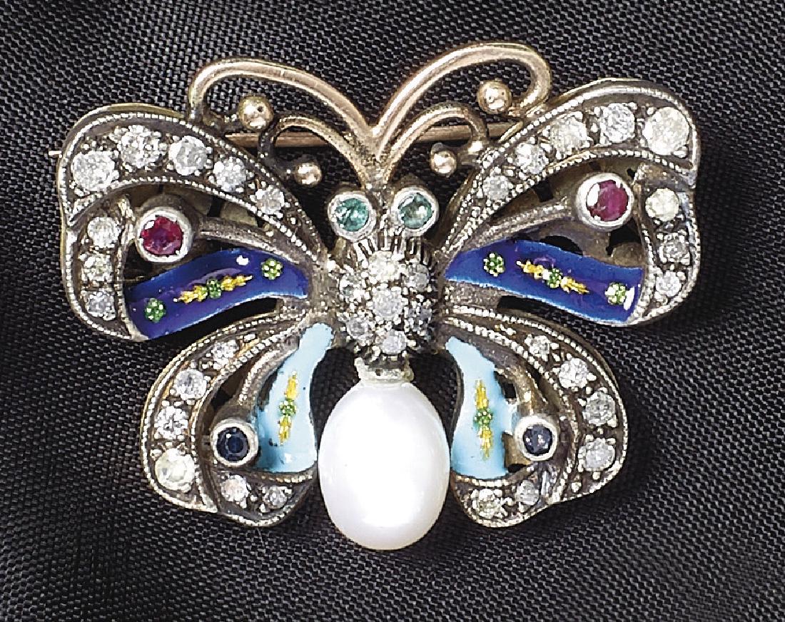 Email-Schmetterlingbrosche â€” 19. Jh.: Enamel butterfly brooch â€” 19th century Openwork, set with two emeralds of a total of approx. 0.06 carats, two rubies of a total of approx. 0.10 carats, two sapphires of a total of approx. 0.06