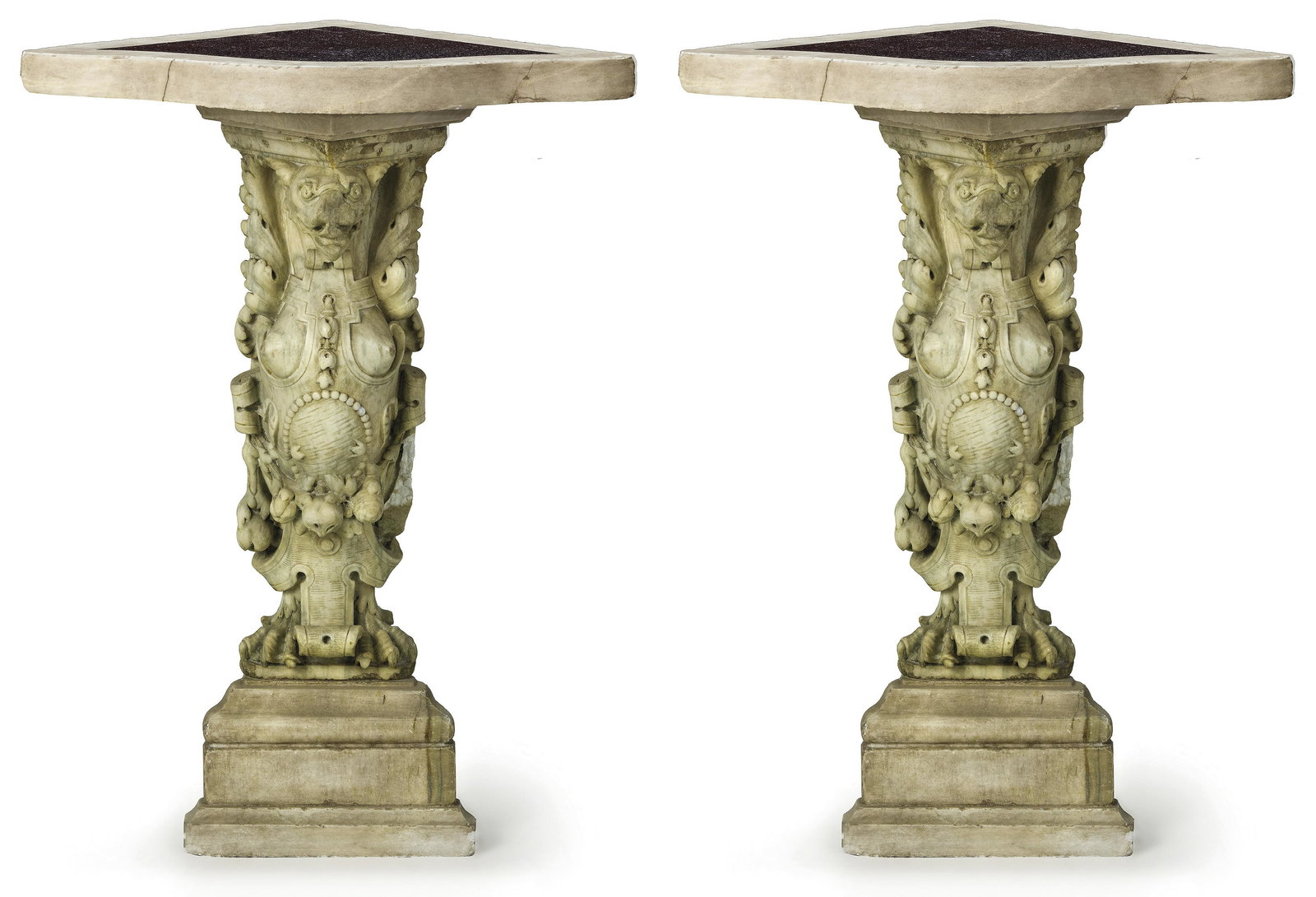 Zwei Eckkonsolen, Norditalien, 19. Jh.: Two corner console tables : North Italy, 19th C. Various marble and porphyry. 90,5 x 45 x 46 cm. - Signs of age, smaller parts lost. - The mythical creatures probably 17th century. // Zwei Eckkonsolen