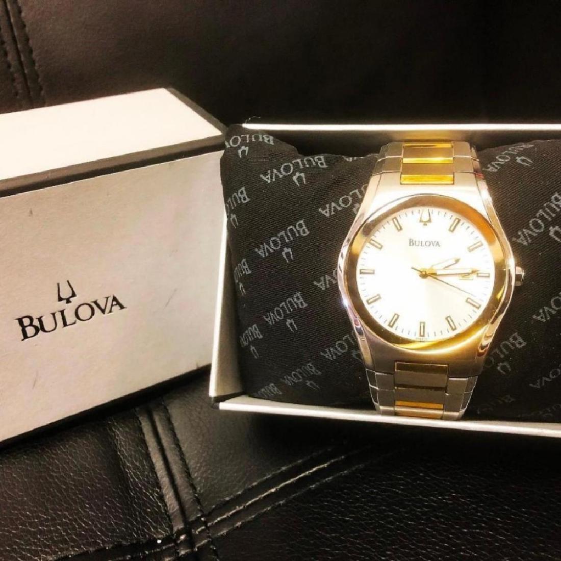 NEW IN BOX- Men's Bulova Gold Plated Stainless Steel: NEW IN BOX! Mens Bulova Gold Plated Stainless Steel Wrist Watch. Comes with all packaging including box and pillow. A stunning piece with excellent craftsmanship. May need battery. - Al