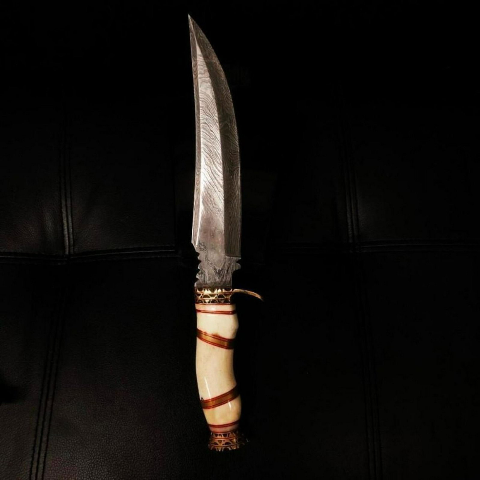 Damascus Knife: High Quality steel is utilized to forge the finest product in the world. Unique Custom Hand-Forged Damascus Steel Hunting Bowie Knife Handle Construction: Camel Bone, Colored Wood and Brass Spacers. B