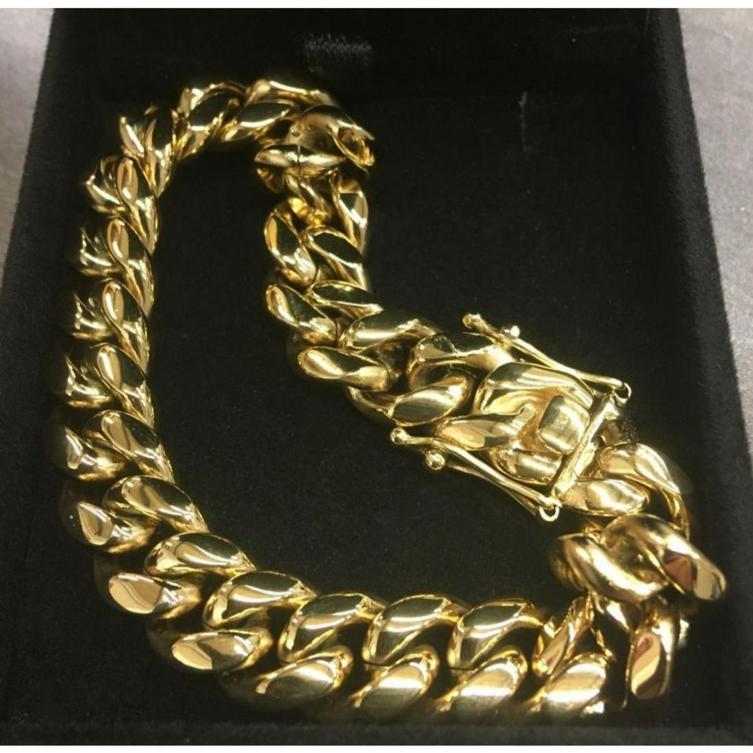 Men's 14Kt Gold Plated Cuban Link Bracelet With Locking: A Men's 14Kt Gold Plated Cuban Link Bracelet With Locking Clasp. Clasp Has Tongue & Fold Over Locking. Total Length Is 8.5 Inches Long By 1/2 Inch width. Bracelet Is In New Condition. View Photos For 