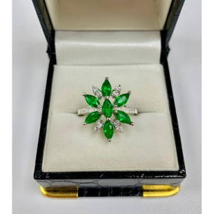 Lovely Ladies Size 7 Green Tourmaline and Sterling: A symmetricallyÂ designed ring, with Seven 0.18ct Marquise cut green Tourmaline Stones. Bordered by eight round cut crystals. all set in a sleek 925 Sterling Silver ring. Please view photos for
