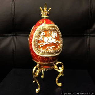 Faberge Style Merry Go Round Egg A Great Mantle Piece: A Merry Go Round Faberge Style Egg In Navy Box. This Display Piece Winds Up And the Merry Go Round Rotates To The Music. Doctorate Front and Rear Door That Opens To Display The Revolving Horses