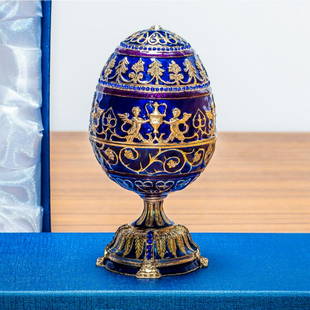 1912 Tsarevich Royal Russian Egg: 1912 Tsarevich Royal Russian EggÂ 5.5 Inches Tall Enamel Gold Plated Pewter, Austrian Crystals Hand-Painted Padded Satin Lined Gift Box Imported This sparkling egg is adorned with clear crystals