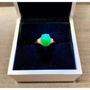 Genuine Hand Polished Jade Stone Mounted In 14K (585): A Genuine Hand Polished & Carved Jade Stone Mounted In 14kt (585) Gold Setting With 8 Set Diamonds. The Ring Displays A Cluster Of Diamonds (4) On Both Sides Of The Mounted Oval Jade Stone. The Ring