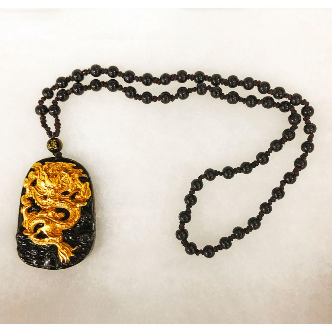Natural Black Obsidian Asian Dragon Pendant: Natural Black And Gold Obsidian Asian Dragon Medallion on a Black Jade Bead Necklace. See photos for Further Inspection.