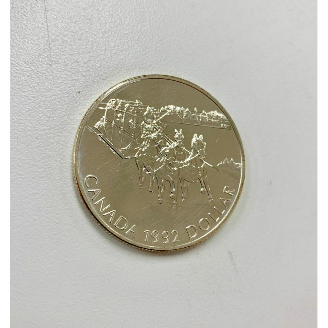 1 Dollar - Elizabeth II Kingston Stagecoach: Commemorative issue 175th Anniversary of the Kingston Stagecoach Obverse Elizabeth II head right Lettering:Â ELIZABETH II D G REGINA Engraver:Â Dora de Pedery-HuntÂ Reverse Stage coach Letterin