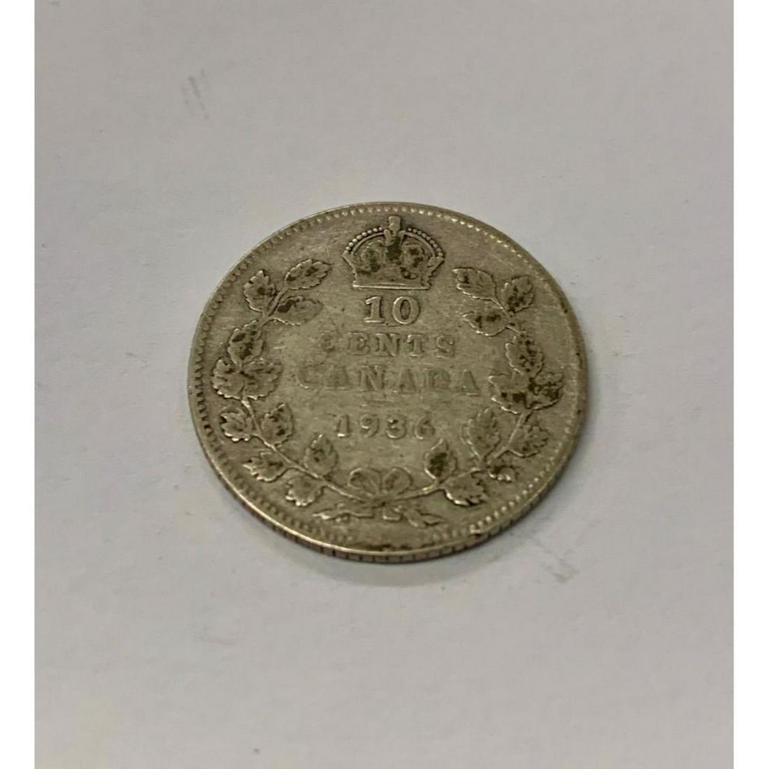 1936 Canadian Grade VG 10 Cent Coin: Obverse The portrait in left profile of George V is surrounded with the inscription "GEORGIVS V DEI GRA: REX ET IND:IMP" (George V, King and Emperor of India by the grace of God) Lettering:Â GEORGIV