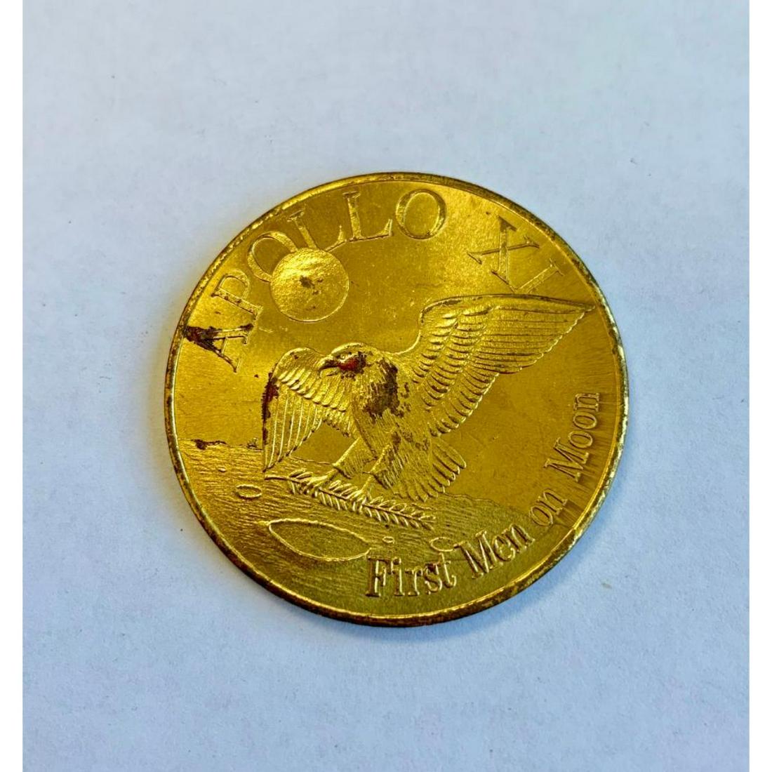 Apollo 12 XII - second Lunar Landing 1969 Coin: This coin is a memorial piece, following the first moon landing in 1969. It is made of brass, but the coin's obverse and reverse are unique and hard to find. Please view photos for further details.Â�