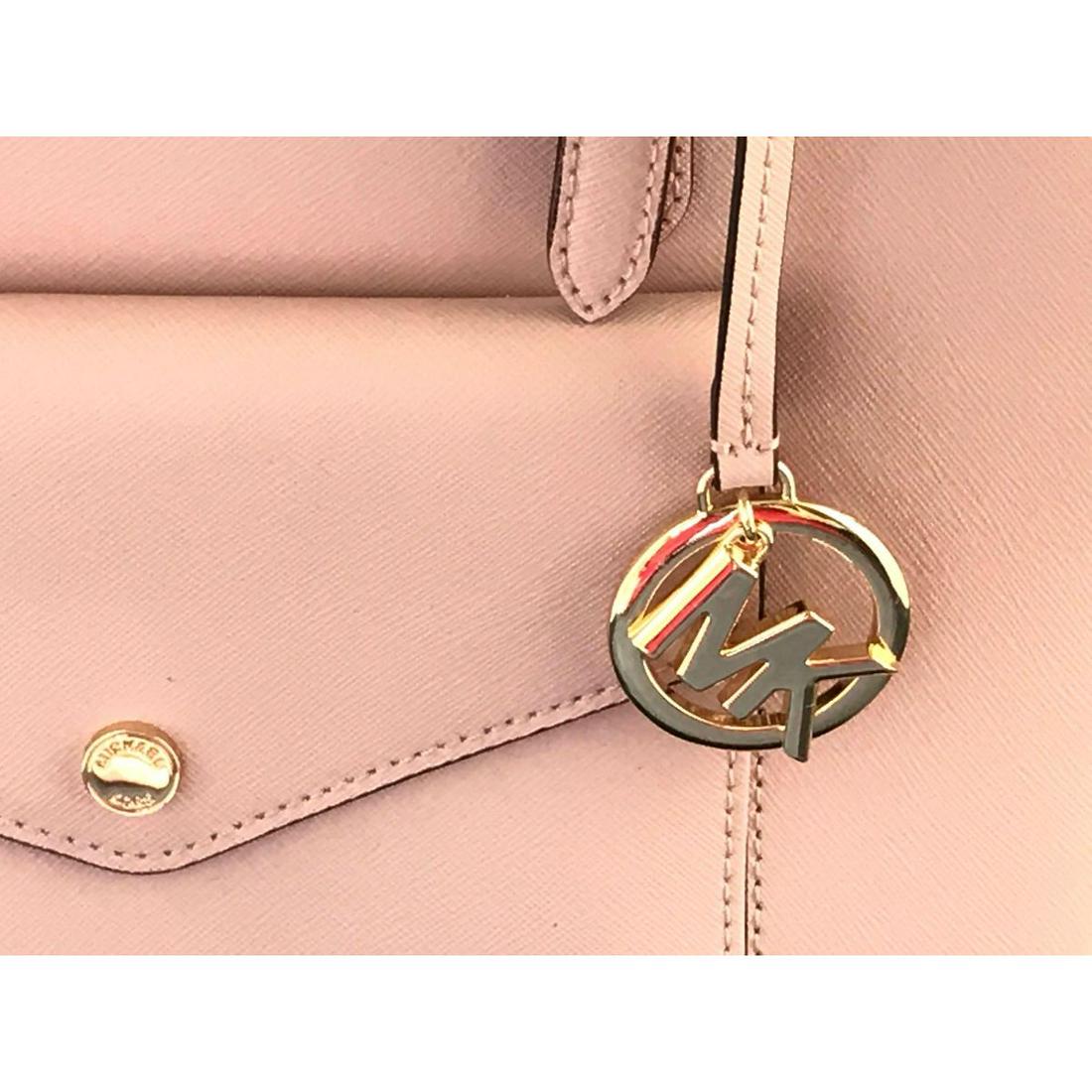 Michael Kors designer purse: Pink, genuine leather Michael Kors designer purse with strap and gold snap and MK charm. - #252-252-12