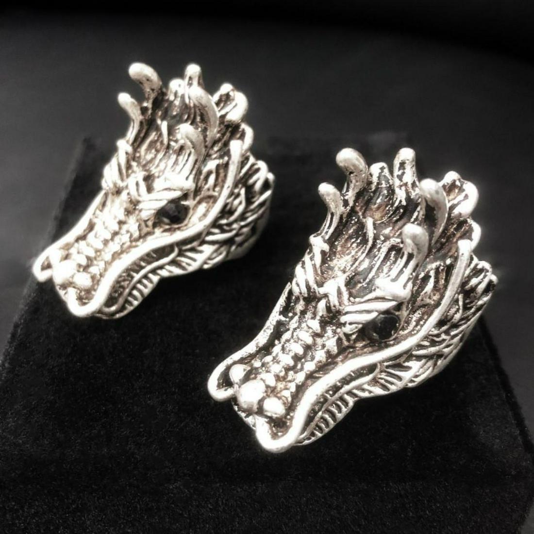 2 Exquisite Chinese Miao Silver Dragon Head Rings: 2 Large Exquisite Chinese Miao Silver Handmade Black Eye Dragon Head Rings, Great Attention To Details. Comes with box. See Photos for further inspection.