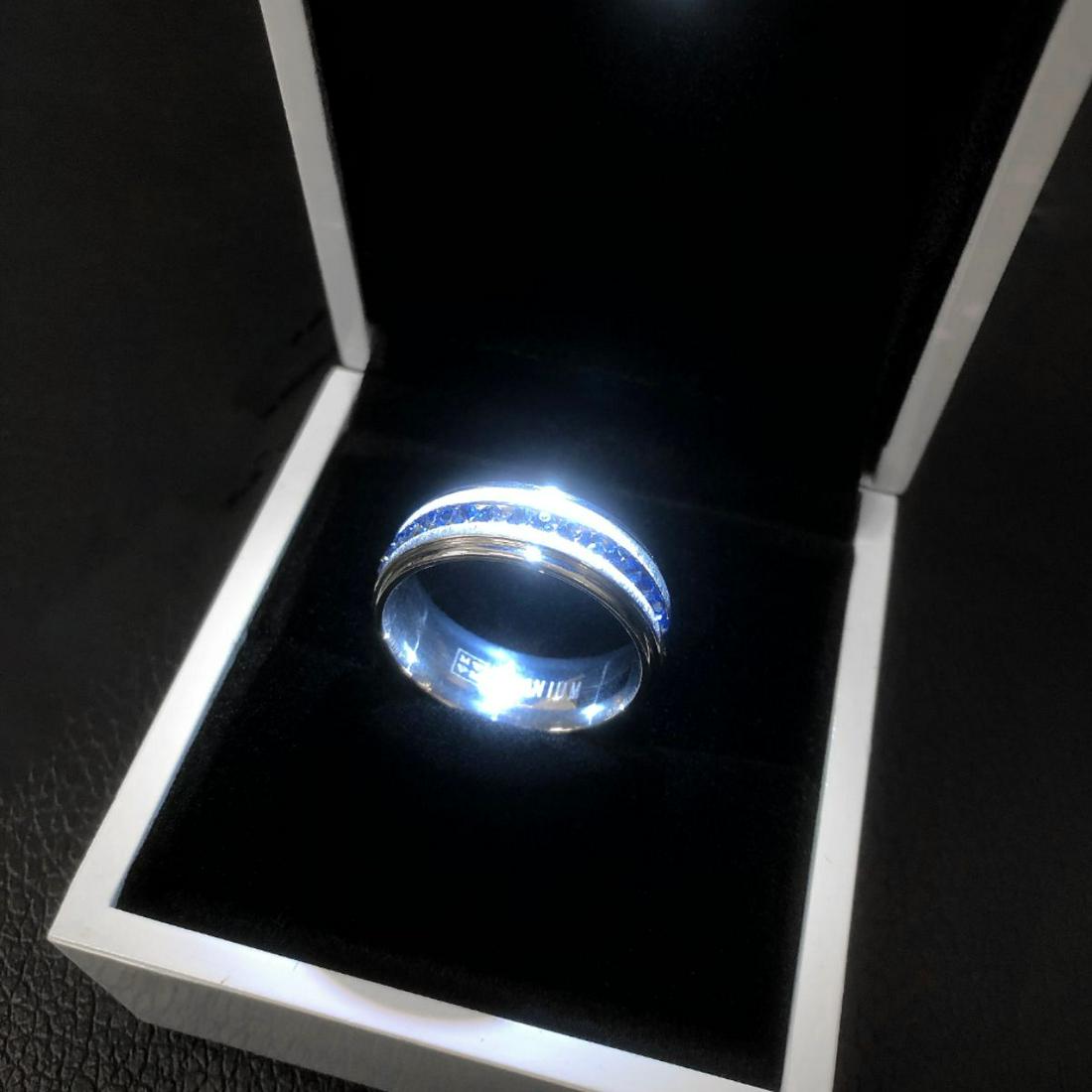Titanium Steel Silver Blue Engagement Ring: Ladies Titanium Steel Silver Brushed, Blue Engagement Ring. Brand New, Size 10. Comes In White Enameled LED Ring Box. See Photos For Further Inspection.