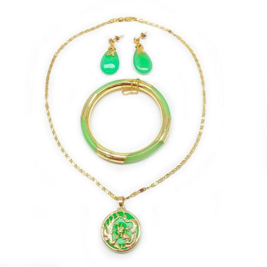 4 Piece Gold Plated & Green Jade Jewelry Set.: 4 Piece Gold Plated & Green Jade Jewelry Set. Set Comes With Bracelet, Necklace with Pendant and Earrings. View Photos For Further Details.