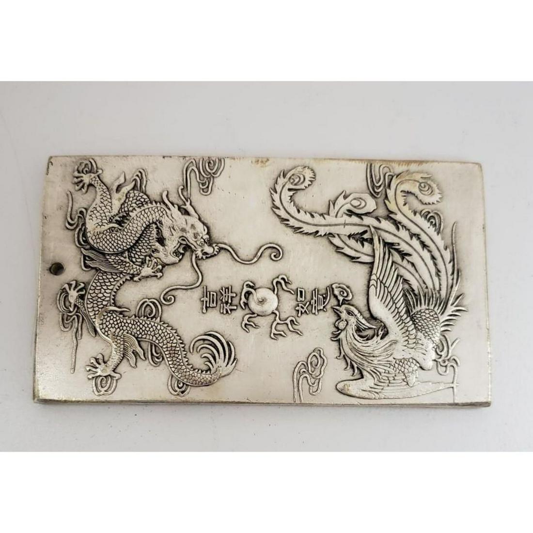 Asian Tibetan Silver Flying Dragon, Rooster Zodiac: Asian Tibetan Silver Flying Dragon, Rooster Zodiac Bullion Bar. Weighing 127g. Please View Photos For Further Details.
