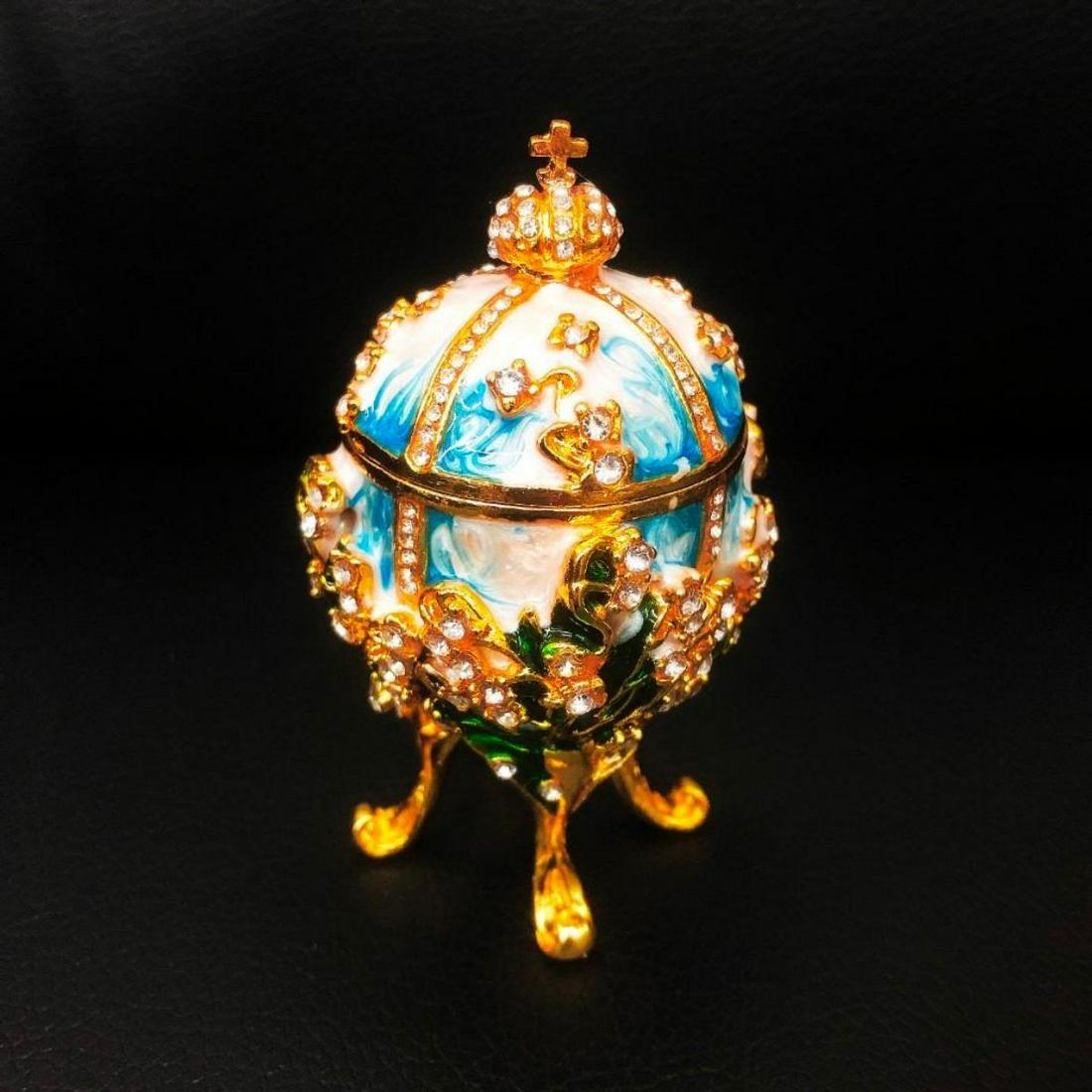 Lily Of The Valley Royal Decorated Semi Precious Stone: The Lilies of the Valley Egg is a jewelled Faberge egg made under the supervision of the Russian jeweller Peter Carl Faberge in 1898 by Faberge ateliers. The supervising goldsmith was Michael Perchin.