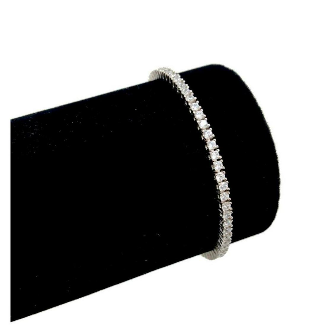 Ladies 6.5" 925 Stirling Silver Tennis Bracelet With: Ladies 6.5" 925 Stirling Silver Tennis Bracelet With Inset Austrian Crystals. View Photos For More Details.