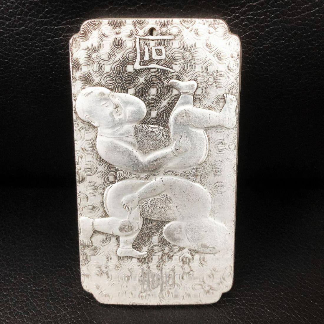 Tibetan Silver Semease Asian Marked Bullion Bar: A Tibetan Silver Bullion With Siamese Twin Figure. The Bullion Is Mark On The Back In Chinese. Weighing 139g.