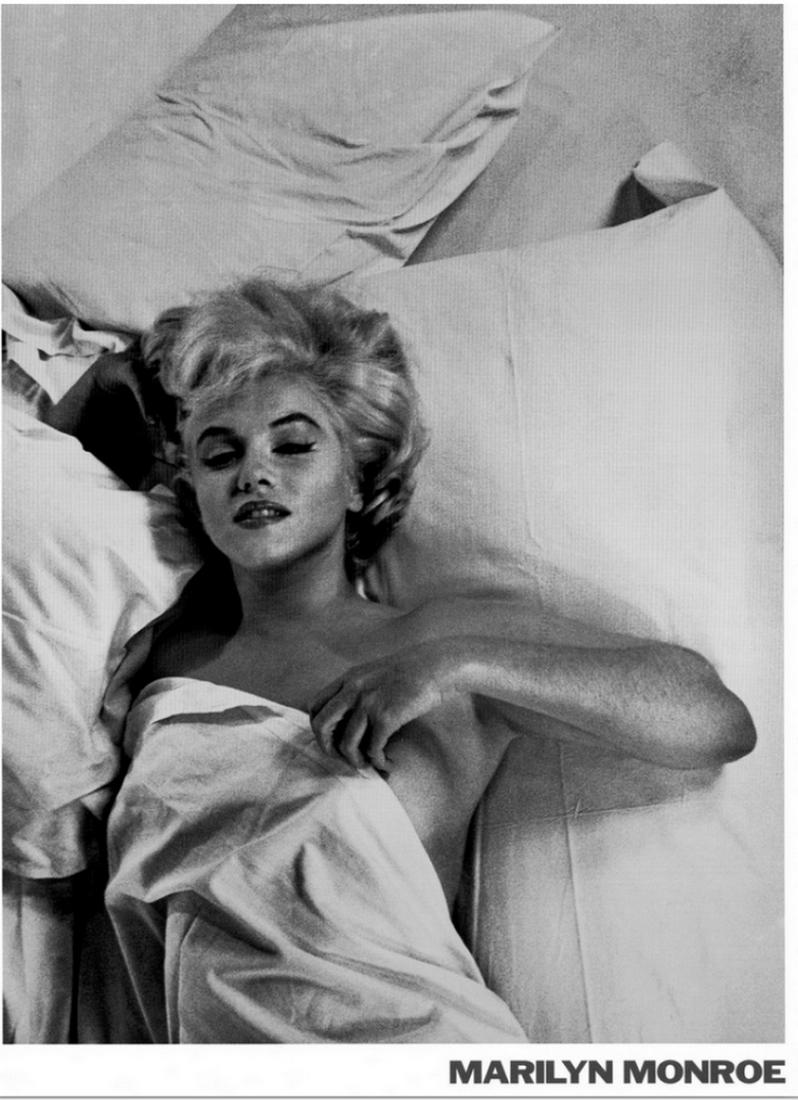 The Beautiful Marilyn Monroe Wall Art Print: The Beautiful Marilyn Monroe Wall Art Print. Large monochromatic photograph shows a famous American actress, model, and singer laying in bed with a blanket over her nude body. This actress was recogni