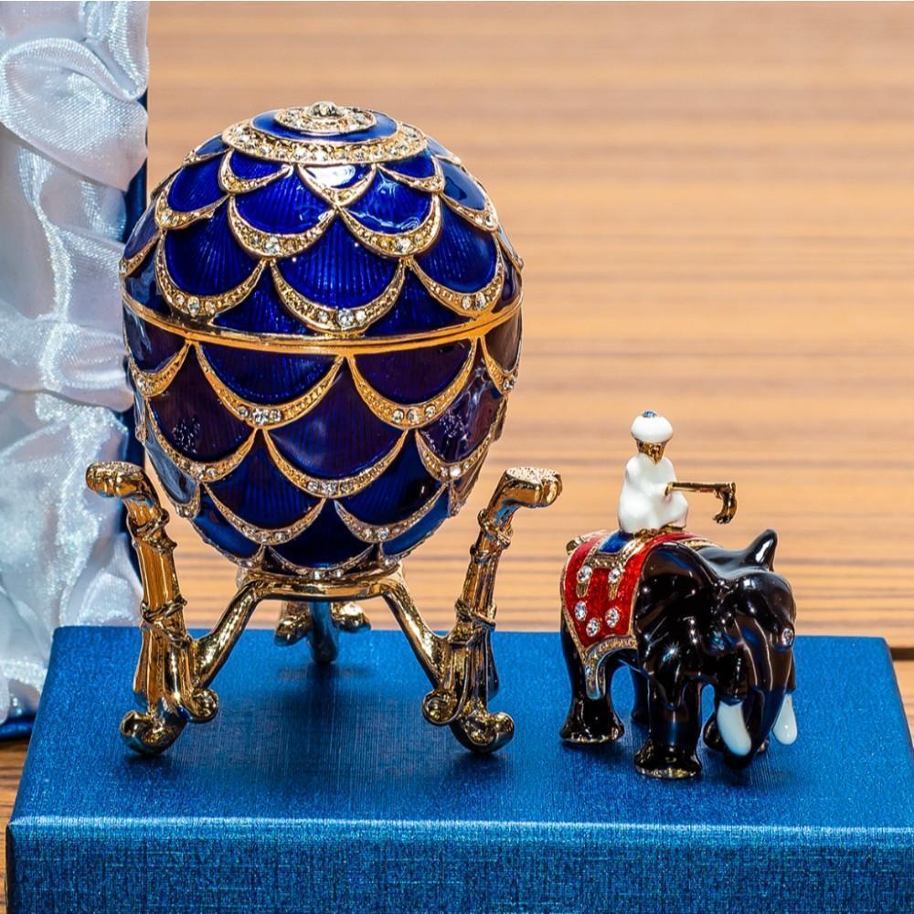 1900 PINE CONE ROYAL RUSSIAN INSPIRED EGG: The Pine Cone egg is a jeweled enameled Easter egg made under the supervision of the Russian jeweler Peter Carl by workmaster Mikhail Perkhin in 1900. One end of the pine cone, a symbol of resurrectio