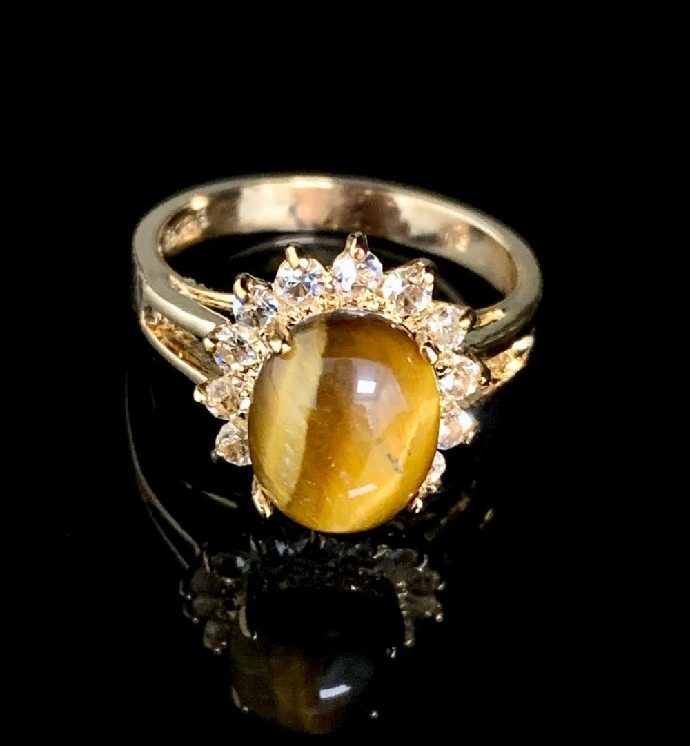 Dolphin Ore Size 7 3ct Oval Cut Tigers Eye in 18K Gold Plated Ring: Dolphin Ore Size 7 3ct Oval Cut Tigers Eye in 18K Gold Plated Ring. Please view photos for further details.