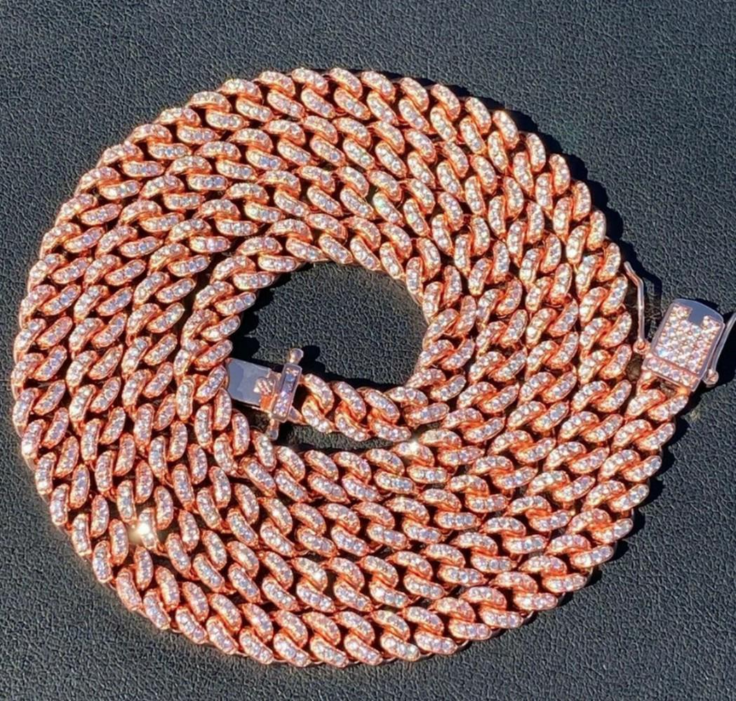 6mm Miami Cuban Iced Out Rose Gold over 925 Sterling Silver Chain: 6mm Miami Cuban Iced Out Rose Gold over 925 Sterling Silver Chain. 6mm wide, 22" long, Approx 50g 10-15ct Man Made Diamonds View Photos for Further Details.