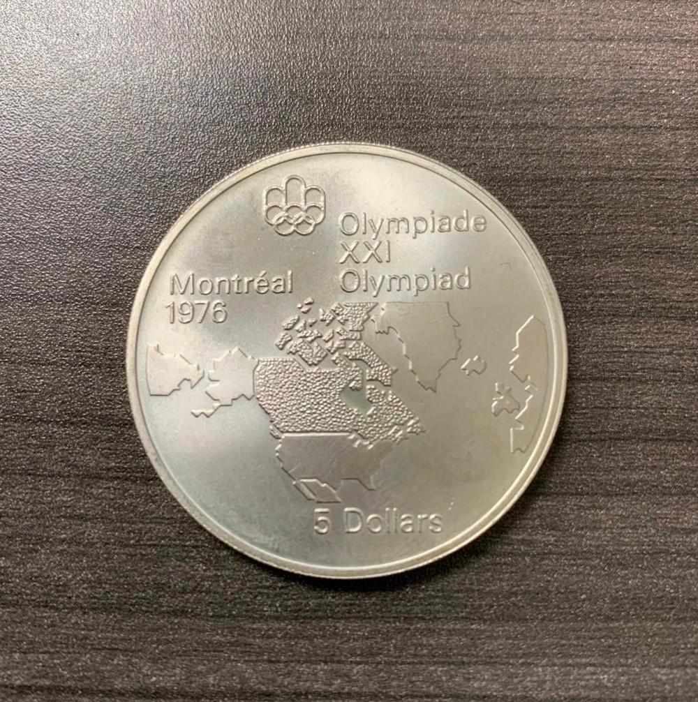 10 Dollars - Elizabeth II Map of the World: Commemorative issue 1976 Olympics, Montreal Obverse Lettering: ELIZABETH II CANADA 1973 Engraver: Arnold Machin Reverse Map of the world, Olympic logo above Lettering: Olympiade XX