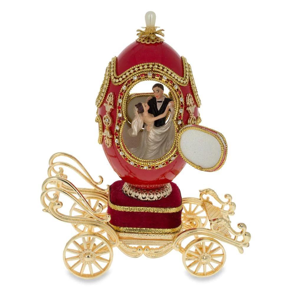 Royal Wedding Coach Musical Faberge Inspired Egg: Royal Wedding Coach Musical Faberge Inspired Egg You'll love the elegance of this golden-hued, royal coach trinket box. Fashioned from fine pewter and hand enameled by our skilled artisans. It op