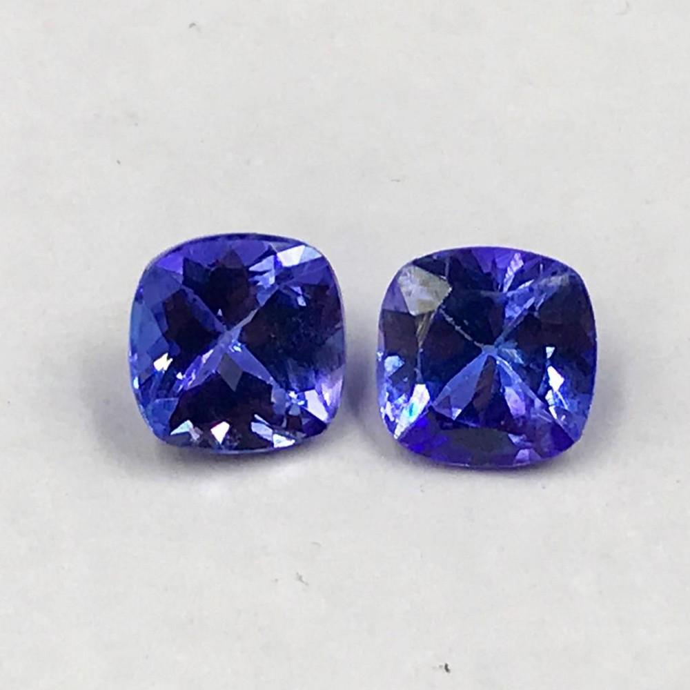 Pair of Faceted Tanzanite Cushions: Pair of Faceted Tanzanite Cushions Tanzanite gems are believed to represent heart and intellect combined with intuition and purity. These stones are used as symbols of dignity, truth, judgement and lo