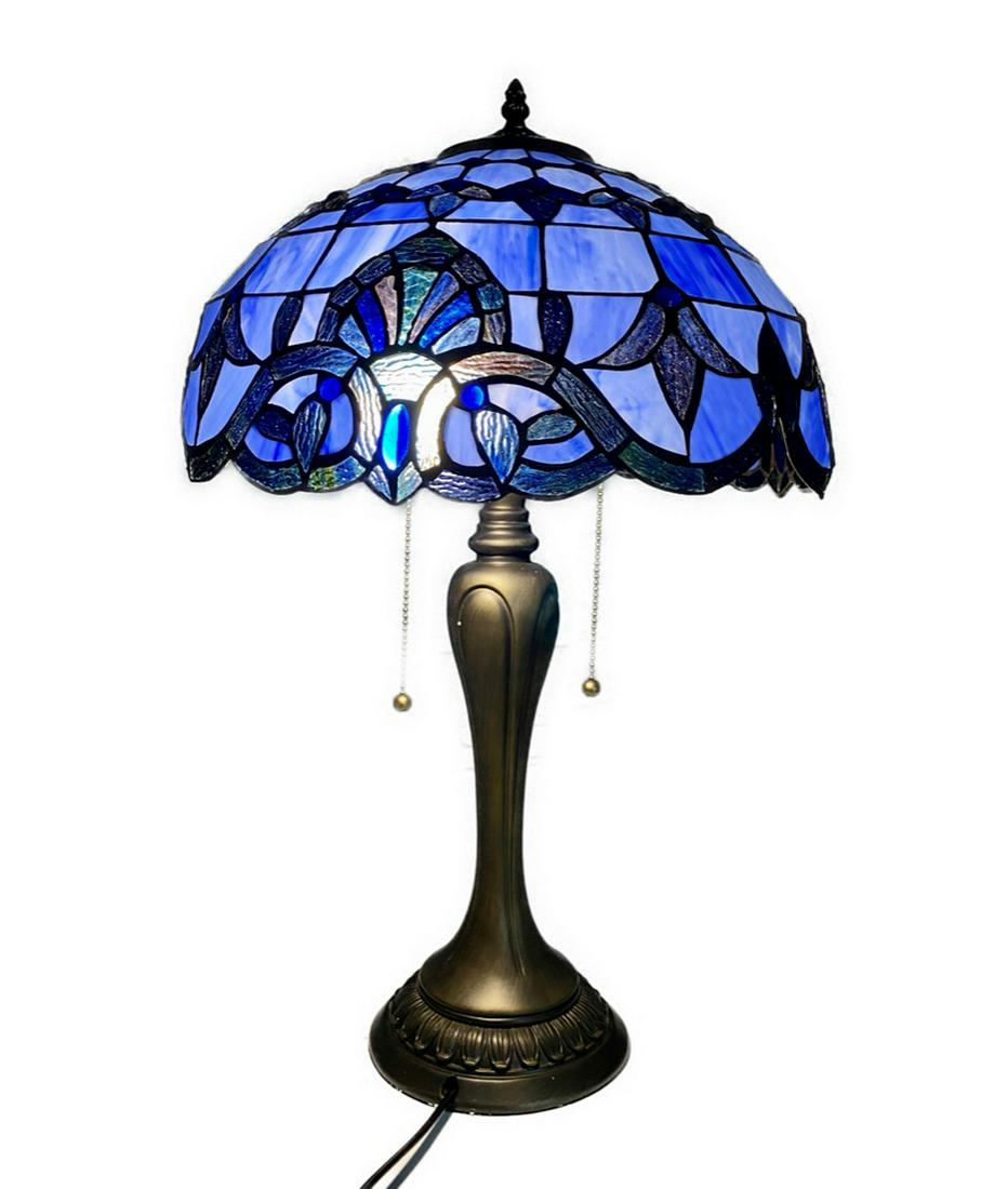 Beaming Blue Stained Glass 24" Tall Tiffany Style Lamp: Beaming Blue Stained Glass 24" Tall Tiffany Style Lamp Handcrafted using the same techniques that were developed by Louis Comfort Tiffany in the early 1900s, this beautiful Tiffany-style piece co