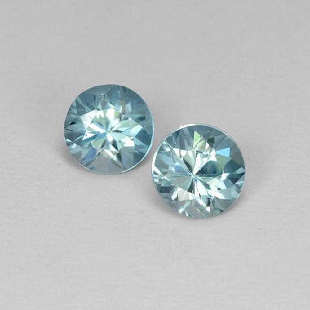 1ct Diamond Cut Light Blue Zircons: 1ct Diamond Cut Light Blue Zircons This lot contains 2 diamond-cut Zircon stones, each at 0.52ct Raw Dimension: 4.5 x 4.5mm Total Carat Weight: 1.03ct Treated: Yes, heat treatment has been use