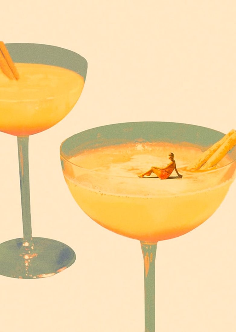 Holiday In A Glass Poster Print: Holiday In A Glass Poster Print Two orange cocktails in elegant glasses. In one of the glasses, a miniature of a human is sitting, like she's on a sunny beach. This print is both elegant and adds