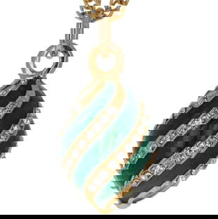 Swarovski Crystal Spiral Emerald Green Egg Pendant Necklace: Swarovski Crystal Spiral Emerald Green Egg Pendant Necklace This artistically crafted egg pendant is emerald green with gold stripes lined with Swarovski crystals. Pendant: 0.8" x 0.4" Cha