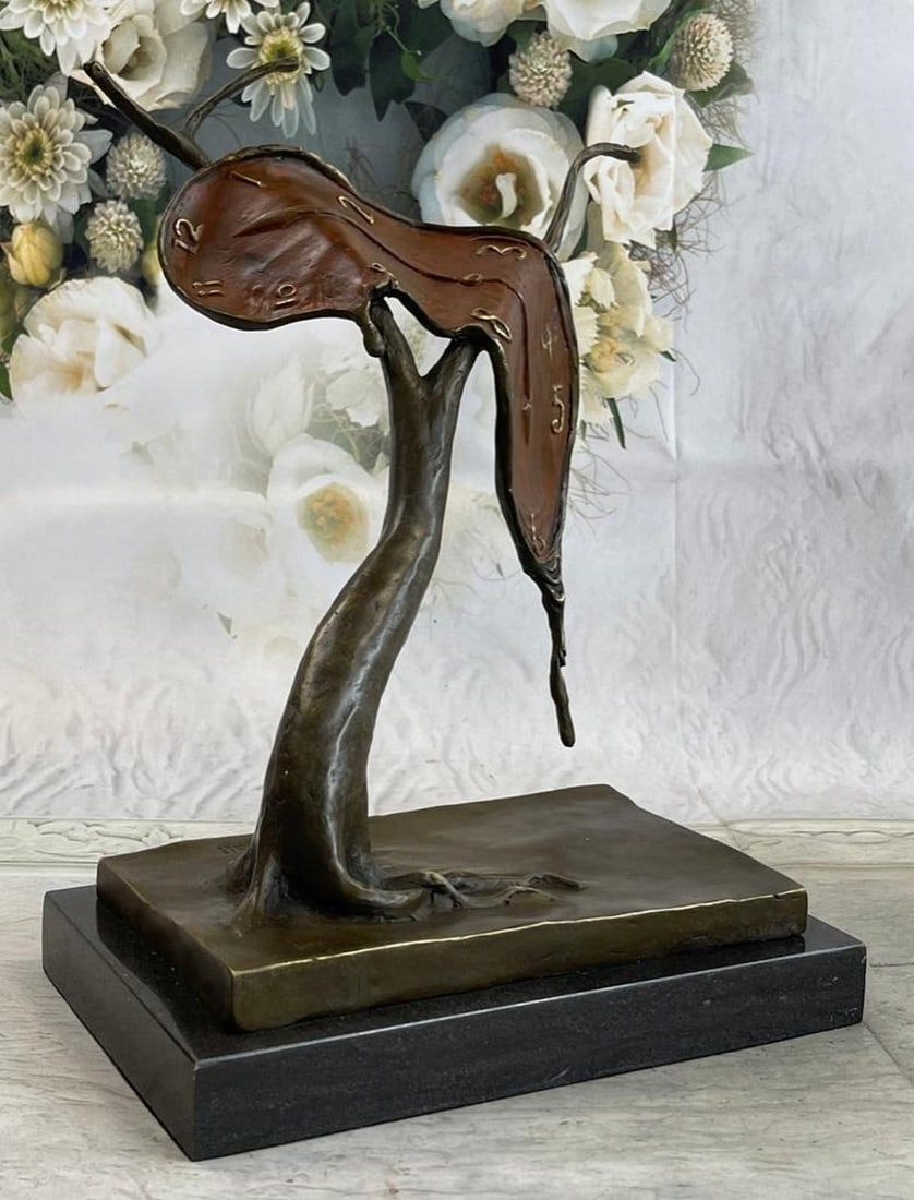 Melting Clock Bronze Sculpture: Melting Clock Bronze Sculpture With this sculpture, Dalí has isolated the central image of his best-known painting and given it the same title. It is an uncomplicated form composed of a melting watch