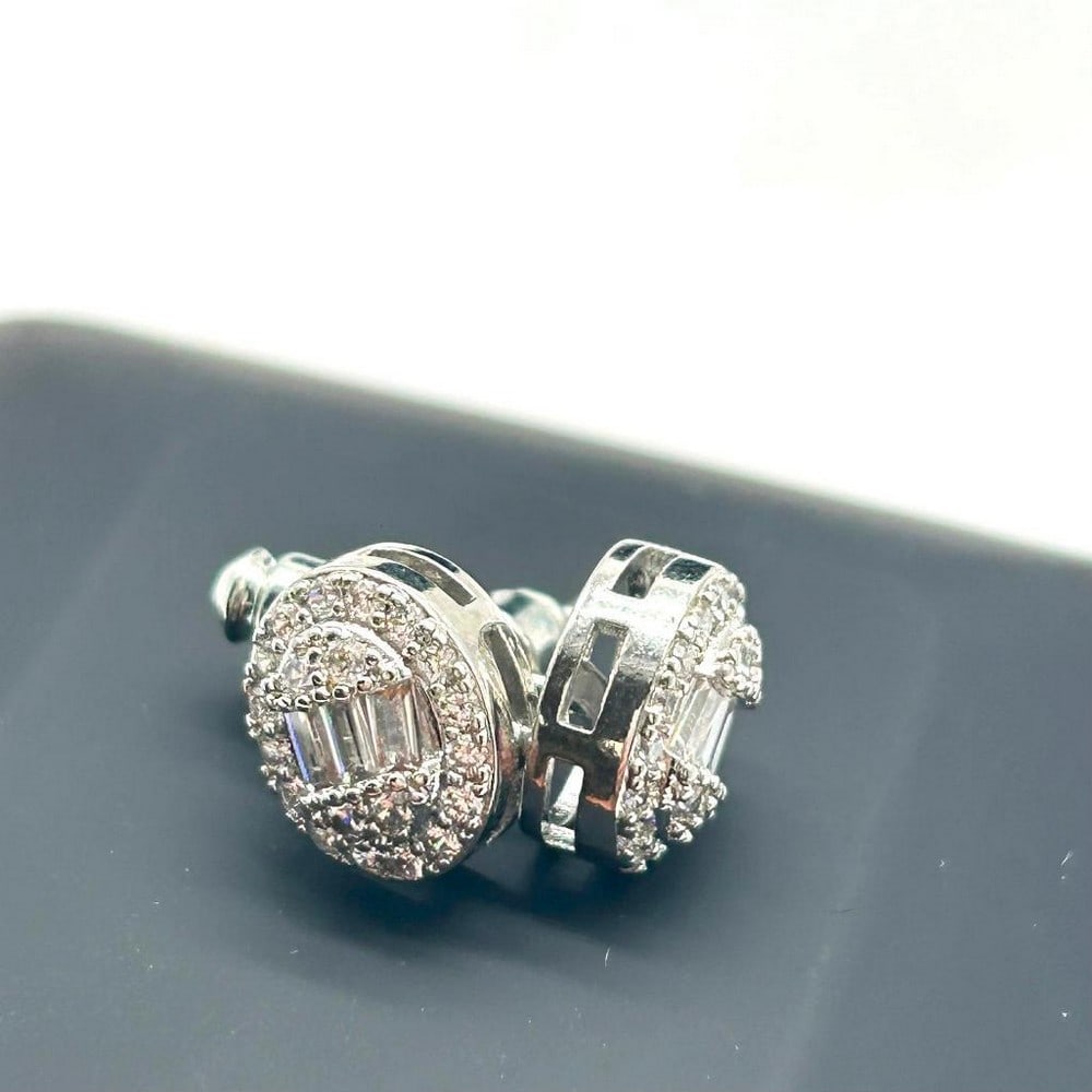 CZ Stud Earrings: CZ Stud Earrings This earrings are elegant and timeless pieces of jewelry that offer a touch of sparkle and sophistication. These earrings feature beautiful cubic zirconia stones, meticulously cut an