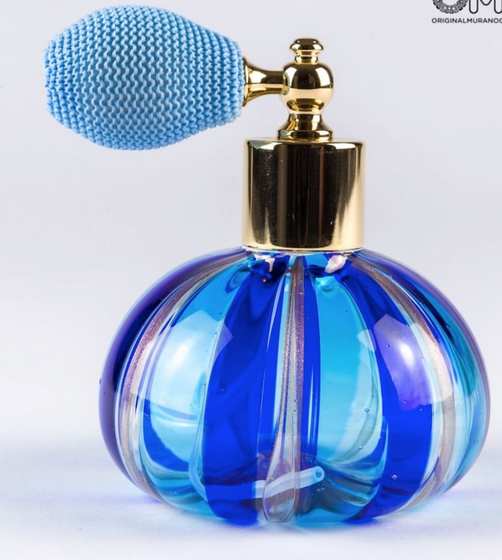 Blue Murano Glass Perfume Bottle: Blue Murano Glass Perfume Bottle Little blue bottle handmade with the technique of blown glass and avventurine. A very good elegant piece perfect to add to a perfume collection. Dimensions: 10 cm