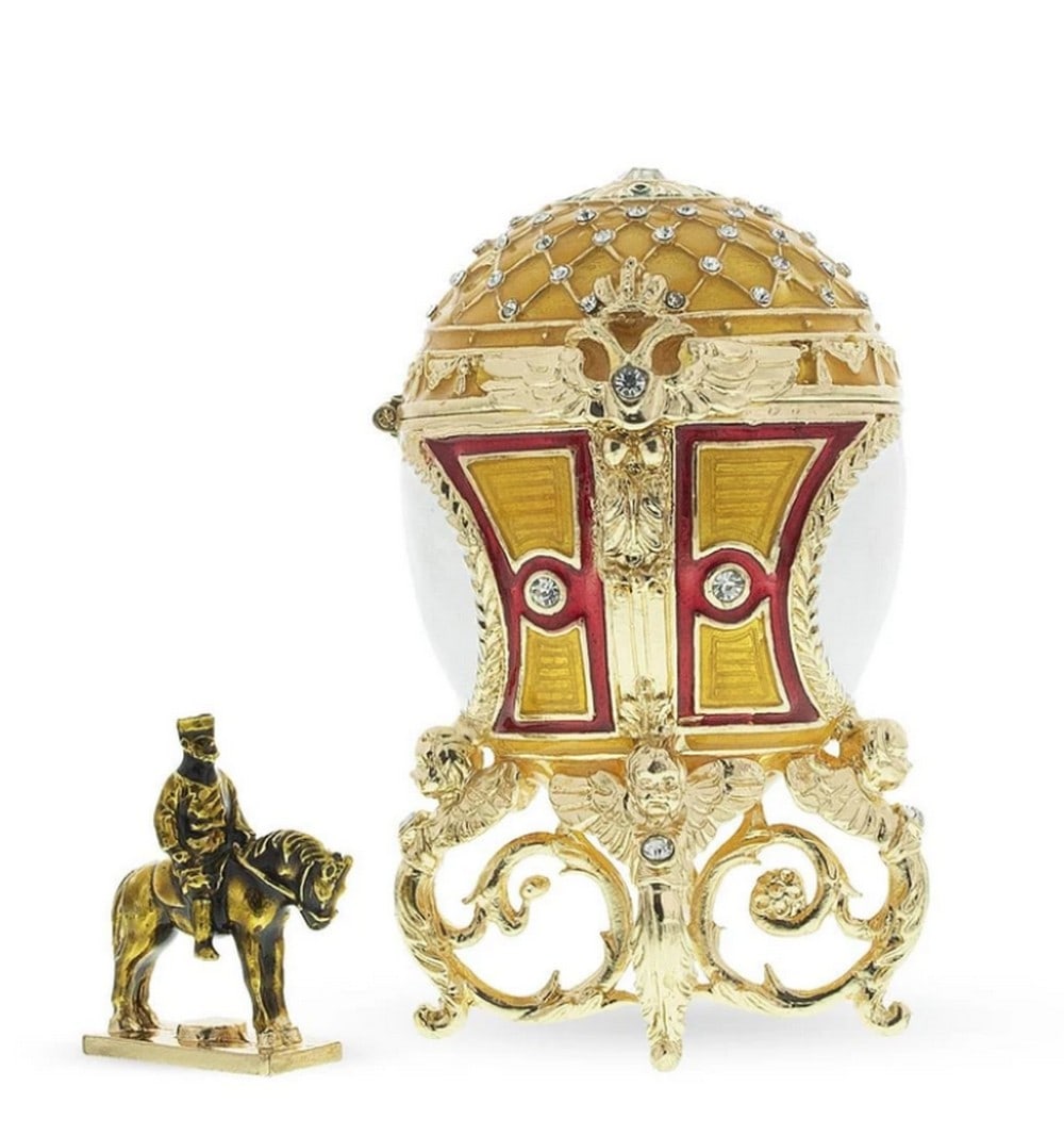 1910 Royal Alexander III Equestrian Russian Inspired Egg: 1910 Royal Alexander III Equestrian Russian Inspired Egg Gold Plated Pewter, Austrian Crystals Enameled The Egg is Openable Hand Painted Dimensions: 3.6 Inches Tall x 2.24 Inches Wide View Phot