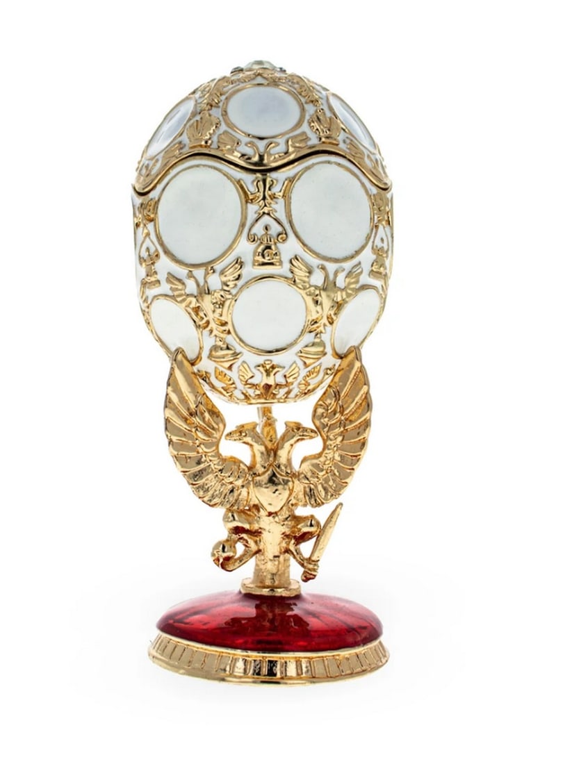1913 Royal Romanov Tercentenary Russian Egg: 1913 Royal Romanov Tercentenary Russian Egg This hand-painted sparkling egg is adorned with a high-polished green enamel with golden trim. It is decorated with light pink enameled roses and green leav