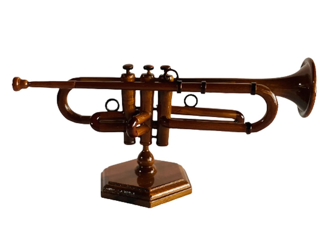 Wooden Model of a Trumpet: Wooden Model of a Trumpet Delight the music lover in your life with this exquisitely handcrafted trumpet, fashioned from rich mahogany and distinguished by its extraordinary detail. The piece serves