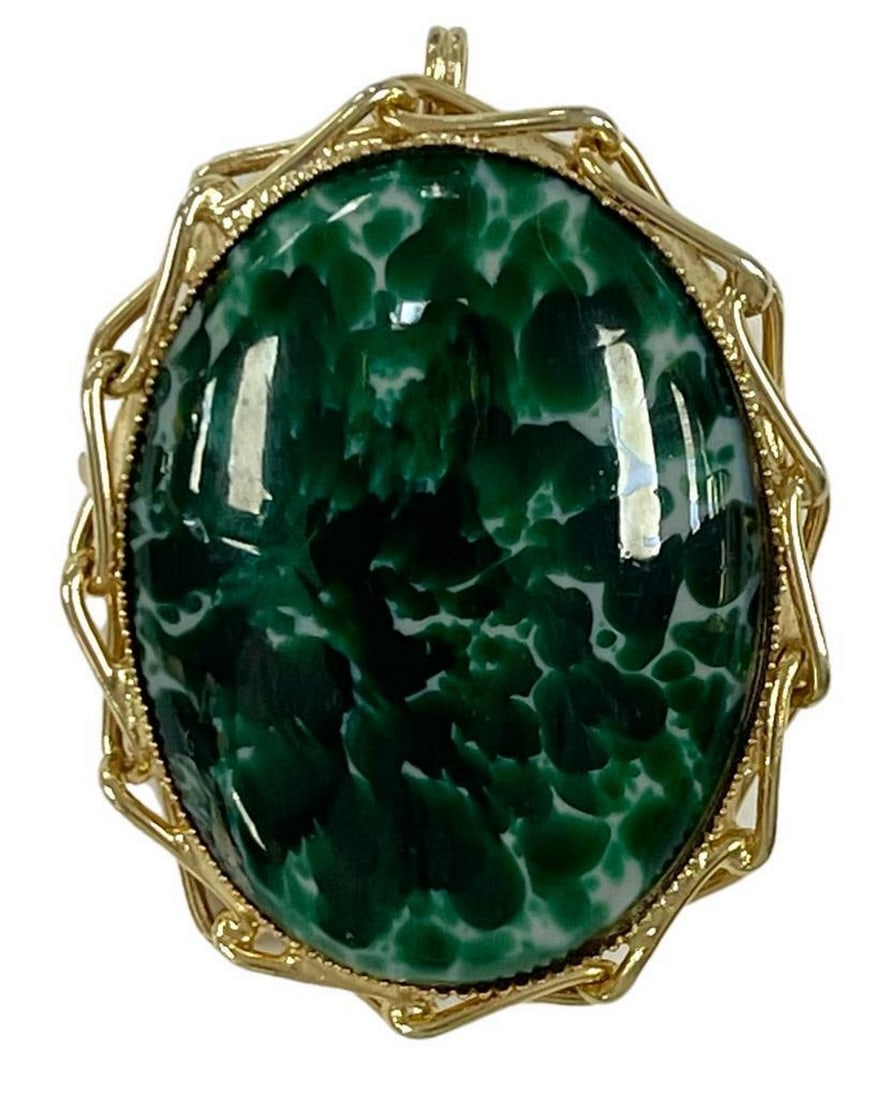 Gilded Malachite Brooch: Gilded Malachite Brooch Introducing our Gilded Malachite Brooch, a harmonious blend of captivating malachite and opulent gold. Malachite, a stone of transformation and protection, is meticulously sele