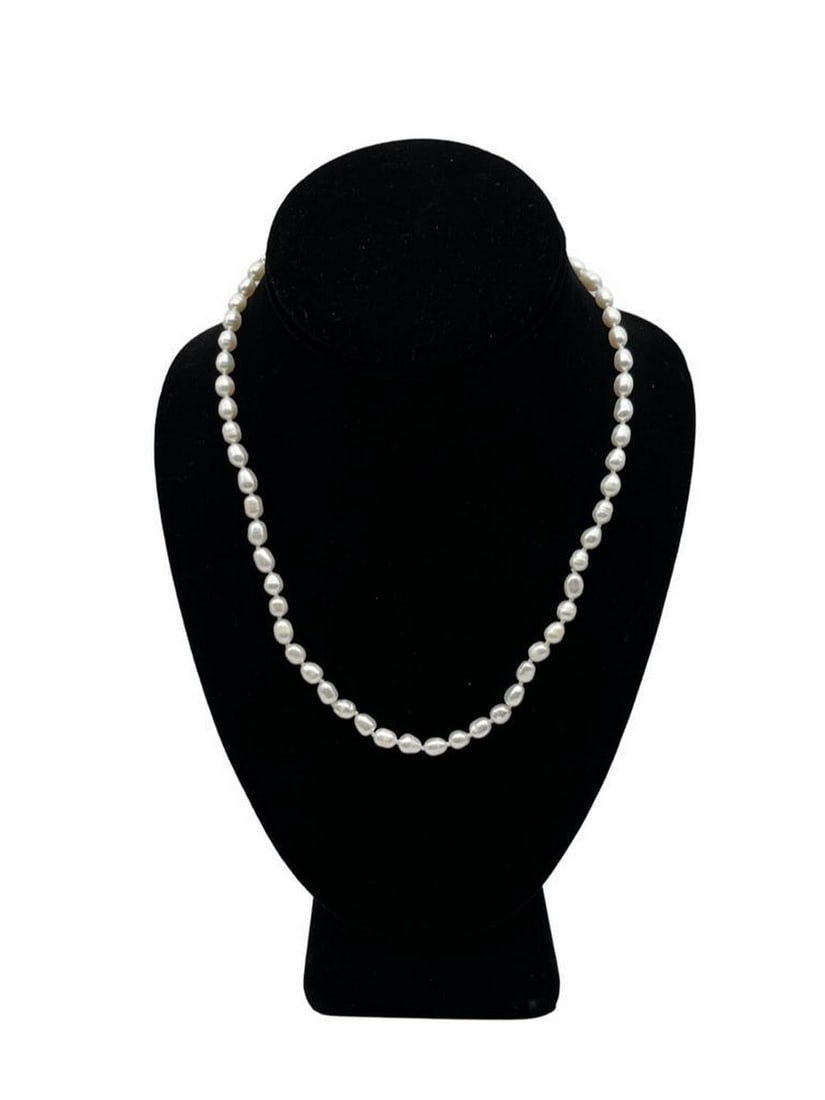 Genuine White Luster Freshwater 4-5mm Rice Pearl Necklace & 4 Pearl Earrings Set: Genuine White Luster Freshwater 4-5mm Rice Pearl Necklace & 4 Pearl Earrings Set. A Very Elegant Design Featuring White Lustering Pearls With A Silver Tone Lobster Claw Clasp. At 18 Inches Of Leng