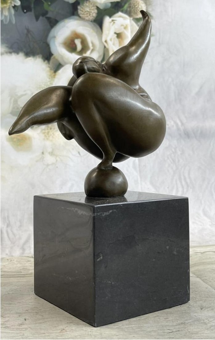Abstract Curvy Woman Balancing Bronze Statue: Abstract Curvy Woman Balancing Bronze Statue. Keeping her body very still, the curvy woman balances her entire body onto a small little ball. The composition recalls the Classical sense yet adopts a m