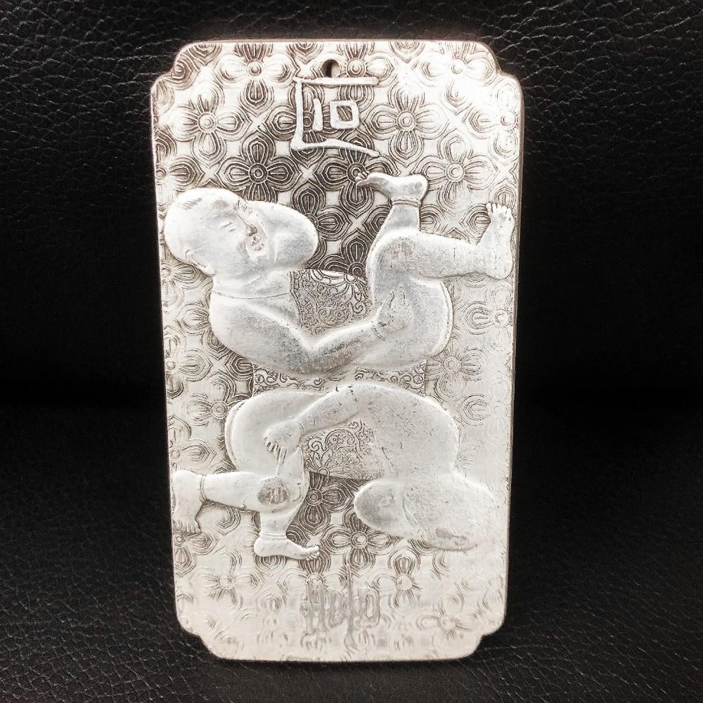 Tibetan Silver Siamese Asian Marked Amulet Bar: A Tibetan Silver Amulet Bar With Siamese Twin Figure. The Amulet Bar Is Mark On The Back In Chinese. Weighing 139g.