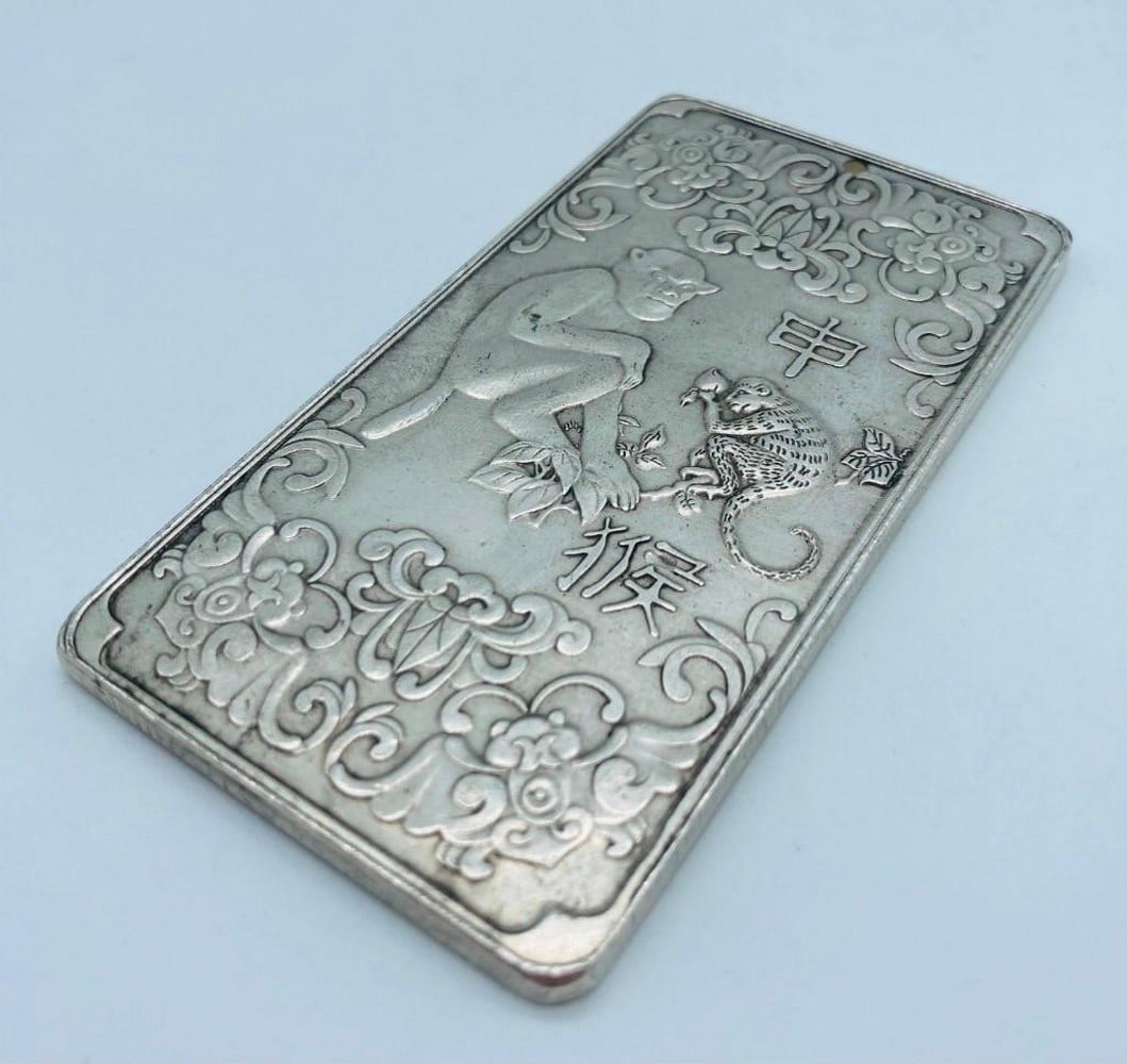 Tibetan Silver Amulet Bar Depicting The Year Of The Monkey: A Tibetan silver amulet bar depicting the year of the Monkey. This amulet bar is one of the 12 Tibetan astrology signs in the 12 piece series. Weighing 132g, 9.5cm in Length, 5cm in Width, 3mm in Thic
