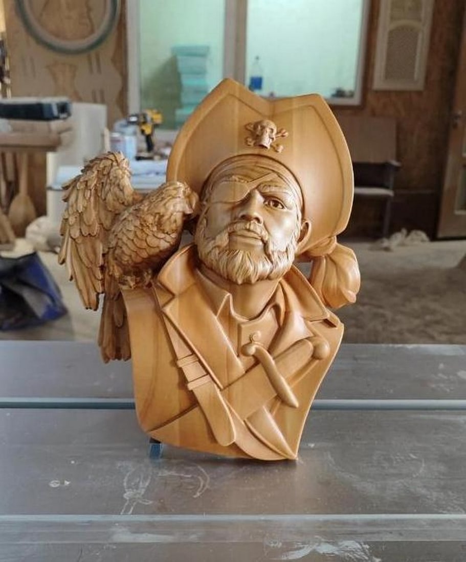 Pirate and Parrot Wood-Carved Wall Decor: Pirate and Parrot Wood-Carved Wall Decor Ahoy, matey! Set sail into a world of adventure with our Pirate and Parrot Cherry Wood Wall Decor. Crafted from premium cherry wood, this dynamic duo captures