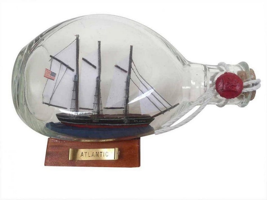 Voyage in a Bottle: Atlantic Sailboat Enchantment: Voyage in a Bottle: Atlantic Sailboat Enchantment. A mesmerizing tribute to nautical adventure captured within a beautifully sealed glass vessel. This exquisite piece features a meticulously crafted A