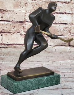 Chasing Greatness Hockey Player Bronze Sculpture - 8" x 8": Chasing Greatness Hockey Player Bronze Sculpture - 8&#34; x 8&#34;.  Inspired by and bearing the signature of artist Mario Nick, this striking bronze sculpture captures the power and precision of a ho