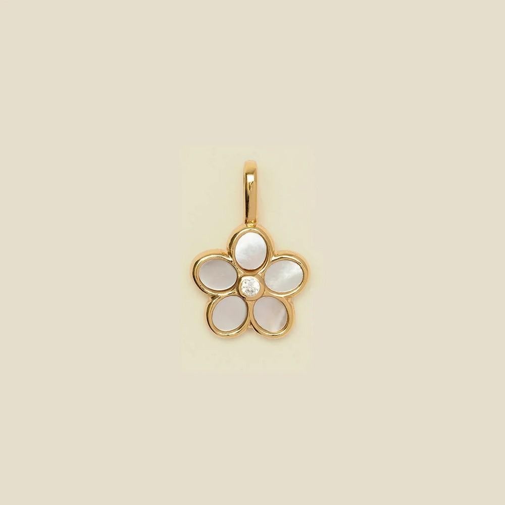 Vermeil Gold Lilly Pendant with Quartz Petals & Cz Center Stone: Vermeil Gold Lilly Pendant with Quartz Petals & Cz Center Stone Embrace your wild, free-spirited side with this dreamy daisy charm. Featuring quartz petals and a CZ center, it adds a touch of cha