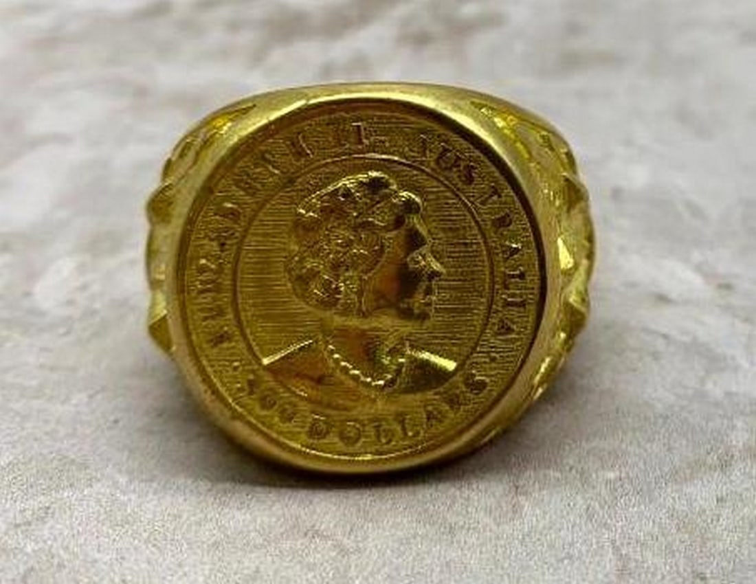 500 Australian Coin Design Gold Plated Ring: 500 Australian Coin Design Gold Plated Ring Celebrate royalty and heritage with this elegant 18k stamped gold-plated ring, featuring a finely carved imprint of Queen Elizabeth II inspired by the icon