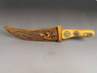 Ancient Chinese Hand-Carved Buffalo Bone Knife with Dragon and Phoenix: Ancient Chinese Hand-Carved Buffalo Bone Knife with Dragon and Phoenix This exquisite ancient Chinese knife is meticulously hand-carved, showcasing the legendary Dragon and Phoenix, powerful symbols